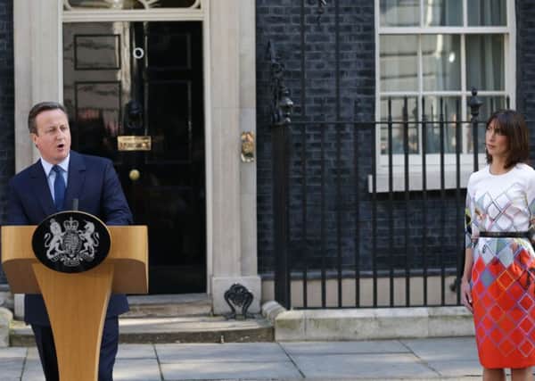 David Cameron speaks outside Downing St watched by wife Samantha