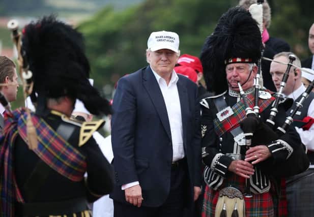 US presidential hopeful Donald Trump arrives at his revamped Trump Turnberry golf course in South Ayrshire.