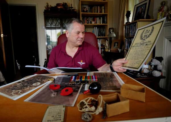 Tony Laking Pictured looking at artifacts that belonged to his grandfather who was in Battle of the Somme, pictured at his home at Eldwick. Picture by Simon Hulme