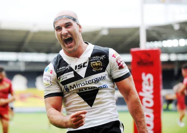 Danny Houghton celebrates his try for Hull FC against Catalans.
