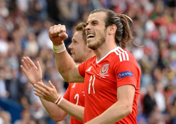 Wales' Gareth Bale celebrates on the pitch after beating Northern Ireland on Saturday. Picture: Joe Giddens/PA .