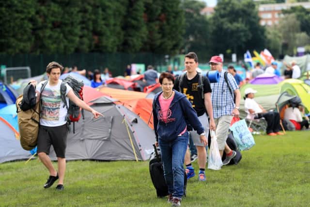 Tennis fans arrive to set up their tents at the back of the Queue ahead of the start of Wimbledon. Picture: Adam Davy/PA.