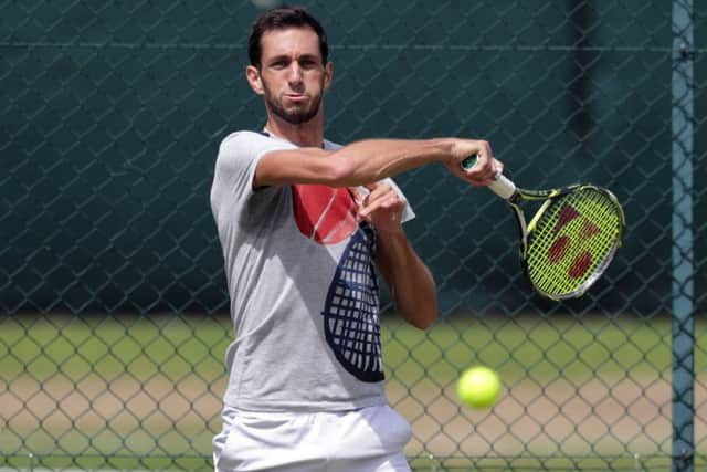 Britain's James Ward practices ahead of his first round clash against defending champion, Novak Djokovic. Picture: Adam Davy/PA.