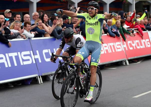 Adam Blythe (right) celebrates after winning the Men's Road race ahead of second placed Mark Cavendish (left). (Picture: Scott Heppell/PA Wire)