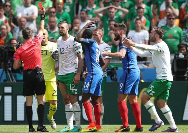 DOWN AND OUT: Republic of Irelands Shane Duffy is shown a red card during their defeat to France at the Stade de Lyon.