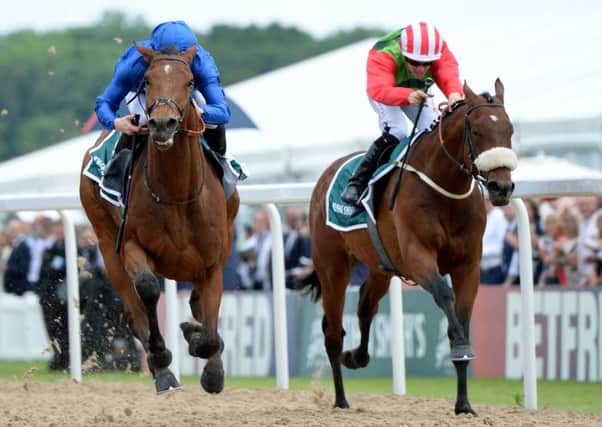 Antiquarium, left, beats Seamour to win the John Smith's Northumberland Plate. Picture: Anna Gowthorpe/PA.