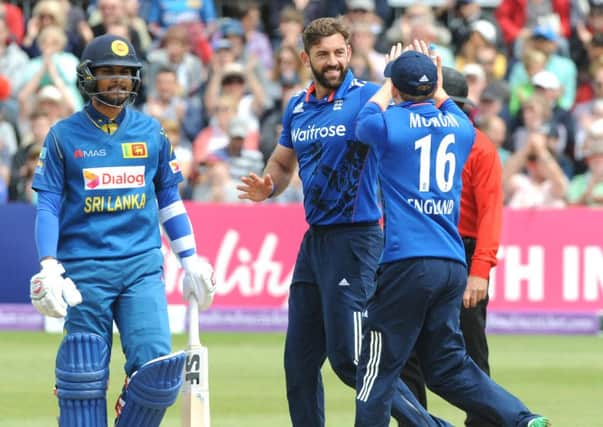IN FORM: England and Yorkshires Liam Plunkett (centre) celebrates with Eoin Morgan after bowling Sri Lankas Kusal Mendis at Bristol on Sunday. Picture: Rui Vieira/PA.