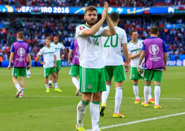 Stuart Dallas salutes the fans after Northern Ireland's defeat to Wales. Picture: PA.