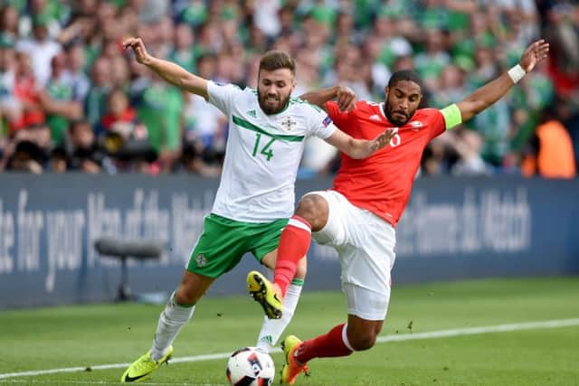 Wales' Ashley Williams (right) and Northern Ireland's Stuart Dallas battle in Paris on Saturday. Picture: Joe Giddens/PA.