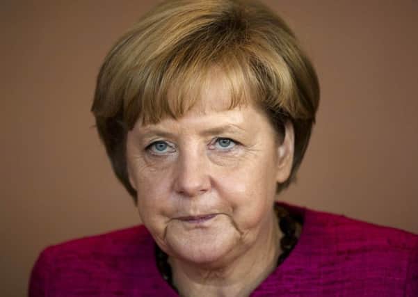 Why has German chancellor Angela Merkel not resigned over the migration crisis?