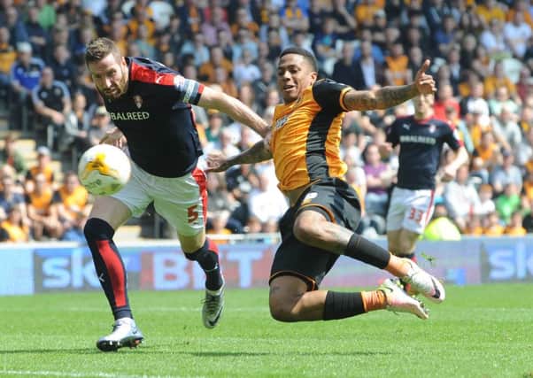 Rotherham United's Kirk Broadfoot gets the better of Abel Hernandez (Picture: Simon Hulme).