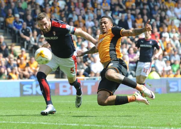 Abel Hernandez is challenged by Rotherham United's Kirk Broadfoot. (Picture: Simon Hulme)