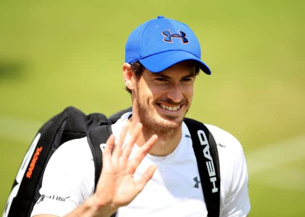 Andy Murray is all smiles following a training session on Monday at Wimbledon (Picture: John Walton/PA Wire).