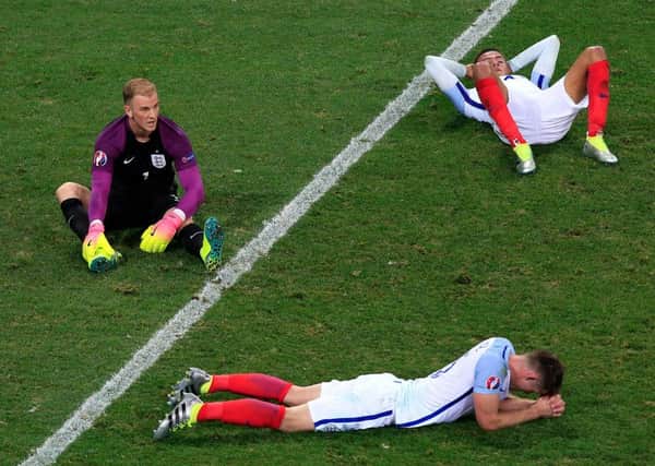 England goalkeeper Joe Hart (left) England's Gary Cahill (bottom) and England's Dele Alli show their dejection after the final whistle during the Round of 16 match at Stade de Nice, Nice, France.  Pic: Jonathan Brady/PA Wire.