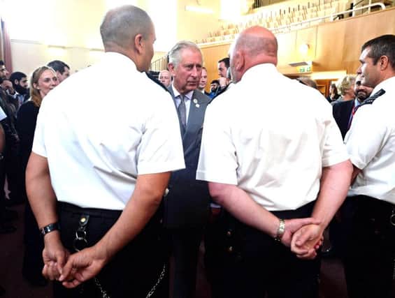 Prince Charles speaks to prison guards at HMP Leeds last September. Picture: Nigel Roddis