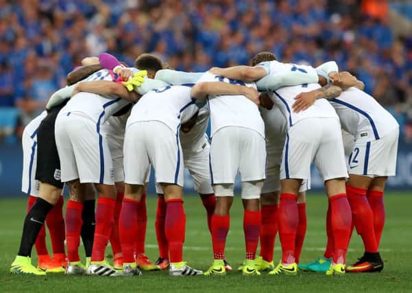 DOWN AND OUT:  England's players in a huddle before their 2-1 defeat to Iceland. Picture: Owen Humphreys/PA.
