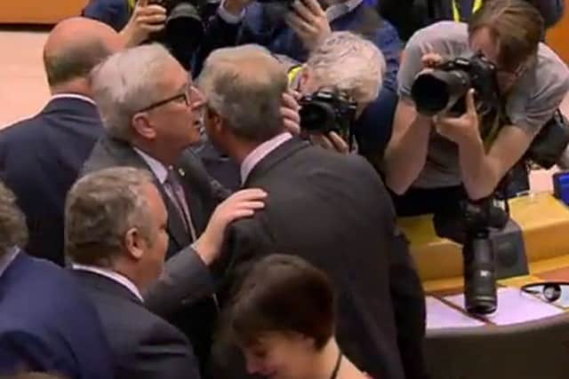 EU president Jean Claude Juncker (left) embracing Nigel Farage in the European Parliament in Brussels, during an emergency session to discuss the fallout from the Brexit vote.