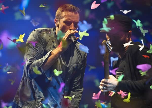 Chris Martin of Coldplay performing at the Glastonbury Festival. Picture Ben Birchall/PA Wire