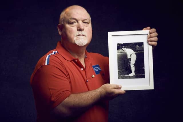 Former England cricket captain Mike Gatting, shown with a photograph of Major Booth, is backing the Royal British Legion's Sport Remembers campaign.