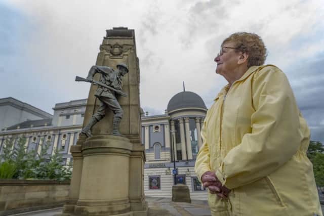 Margaret Spencer,  a member of the Royal Marines Association, looking at the Bradford War Memorial. Picture James Hardisty