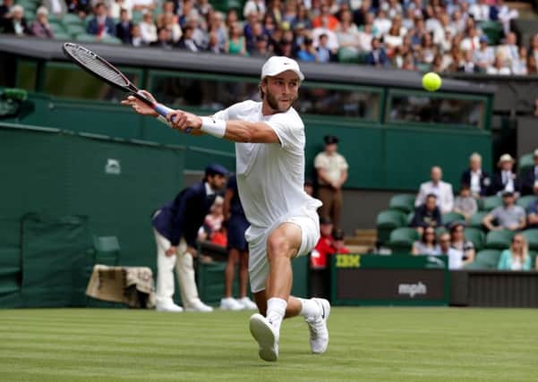 Liam Broady in action against Andy Murray.