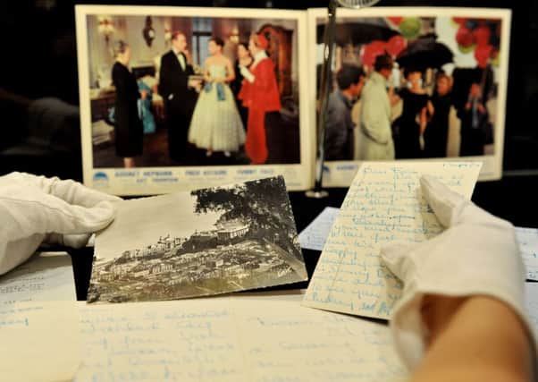Bonham's employee Ruth Fletcher holds Audrey Hepburn's never-before-seen intimate letters which are part of the auction house's upcoming Entertainment Memorabilia sale at their showroom in Knightsbridge, London. Picture: Nick Ansell/PA Wire