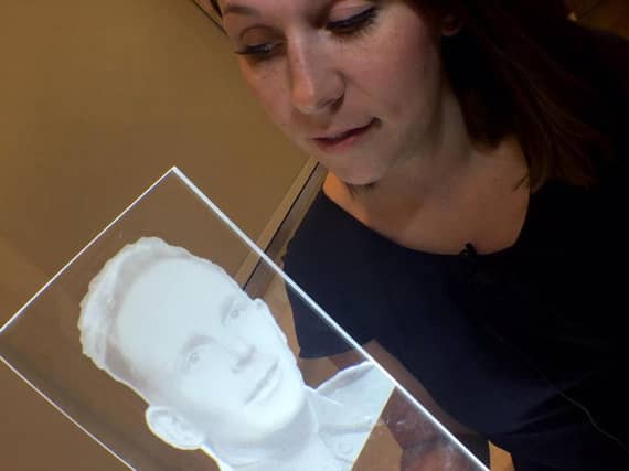 Barnsley Council's Jemma Conway showing how the glass lit panels will look.