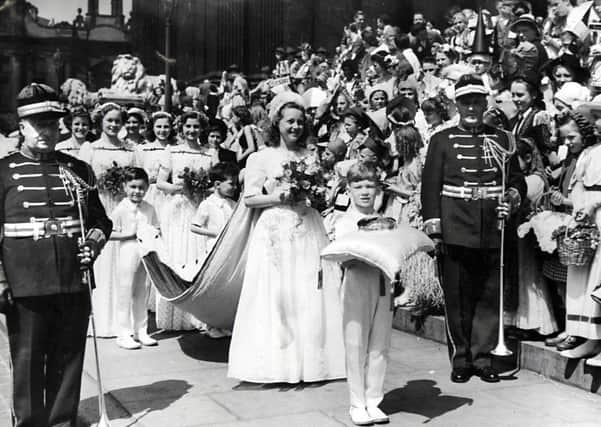 Joan Anne Thompson the Leeds Children's Day Queen in 1949 leaving the Town Hall on a parade.