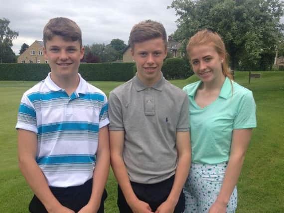 Luke Cranswick, centre, who produced the best net score in the Lightcliffe Open, with best gross prize winner Georgia Holden and Finn Sutcliffe, who had the third-best net score.