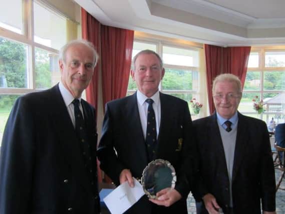 Stephen Larard, left, past president of the Yorkshire Union of
Golf Clubs, with Re-Union Trophy winner John Page, centre, and Alan Barraclough, Honorary Secretary of the Yorkshire Inter-District Union.