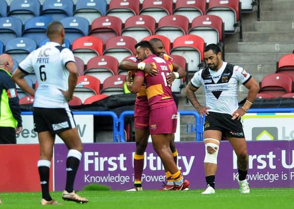 Huddersfield's Michael Lawrence celebrates his opening try.
