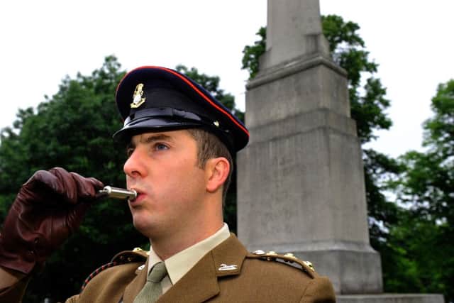 Captain Alex Redshaw from the Yorkshire Regiment blows his whistle three times. The whistle, used in the Battle of the Somme, was blown at 7.30am Friday at York War Memorial. Picture: Gary Longbottom (GL1010/48e)