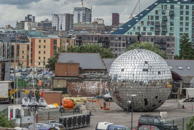 The world's largest disco ball measures 10.33 metres in diameter, with 2500 mirrored titles, and over 11,000 zip ties.  Picture: James Hardisty