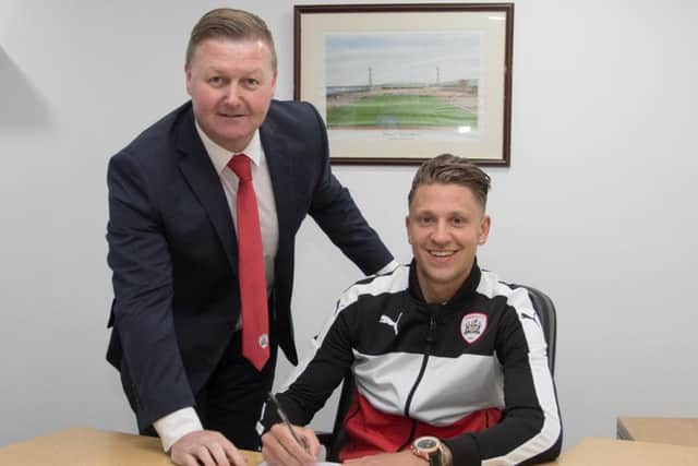 New Barnsley signing George Moncur with Reds chief executive Linton Brown.