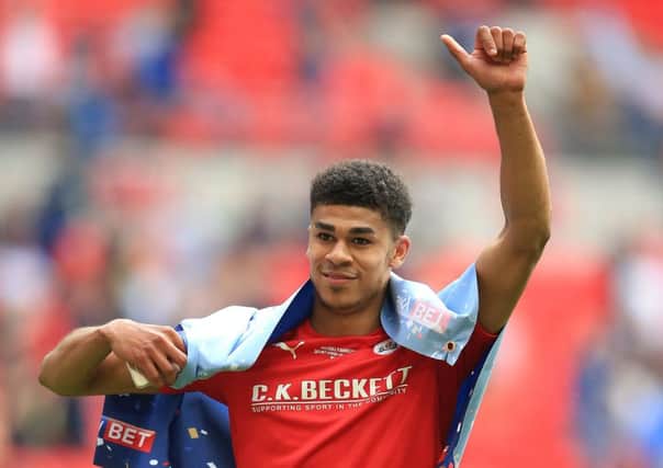 Barnsley's Ashley Fletcher celebrates winning promotion to League One. He is set to join West Ham from Manchester United. (Picture: PA)