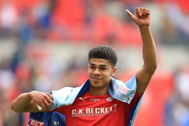 Barnsley's Ashley Fletcher celebrates winning promotion to League One. He is set to join West Ham from Manchester United. (Picture: PA)