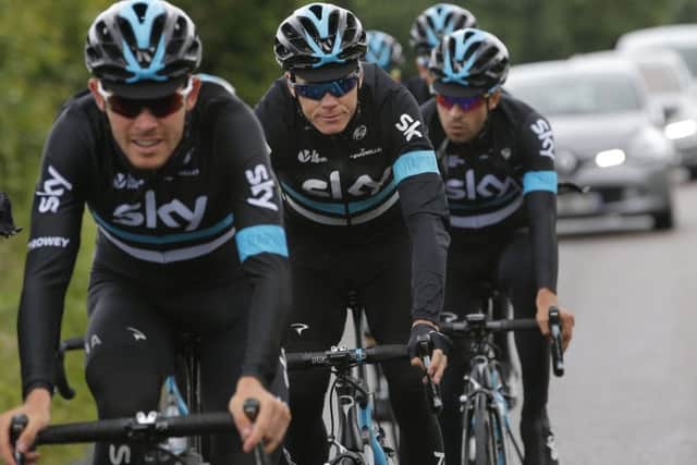 Britain's Chris Froome, second left, rides with his team-mates during a training two days before the start of the Tour de France cycling race, at the team hotel in Port-en-Bessin-Huppain, France. (AP Photo/Christophe Ena)
