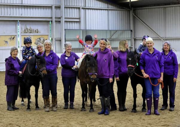 Volunteers with young riders at Follifoot Park Disabled Riders Group, which is one of three charities nominated for the Group award at this year's Yorkshire Children of Courage Awards.