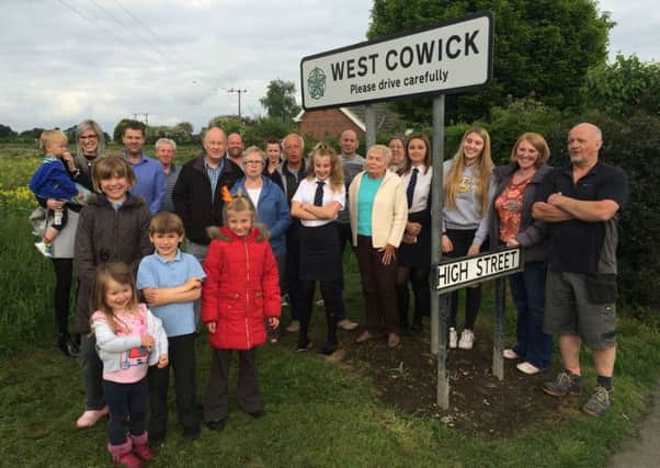 Villagers are urging councillors to reject plans for a housing development which will see their village merge with a neighbouring town.