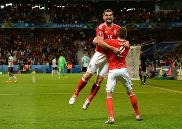 Wales' Sam Vokes (left) celebrates scoring his side's third goal of the game during the UEFA Euro 2016, quarter final match at the Stade Pierre Mauroy, Lille.
