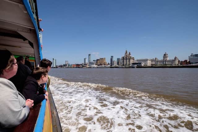 The ferry across the Mersey makes its way back to Pier Head. Picture: Ian Day