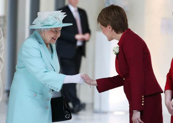 The Queen meets Nicola Sturgeon at the opening of the new Scottish Parliament.
