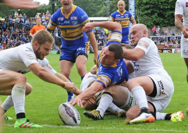 Brett Ferres stretches out but cannot come up with a late Leeds Rhinos try.