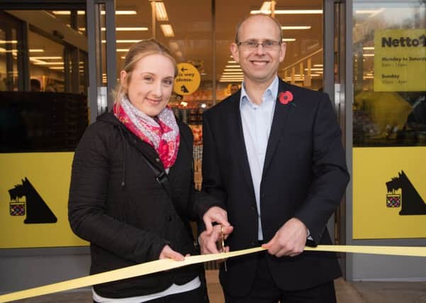 Morton Moberg Nielsen, MD of Netto UK opening the first Netto UK store at Moor Allerton, Leeds, with the first customer Jessica Morgan, 23.