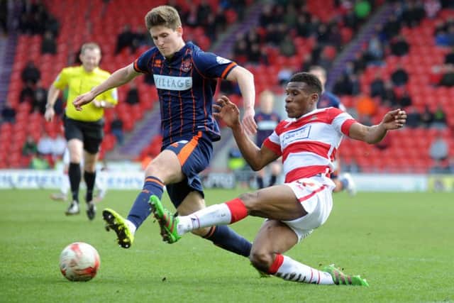 FAMILIAR FACE: Riccardo Calder, right, in action for Doncaster Rovers during the 2015-16 relegation campaign. Picture by Simon Hulme