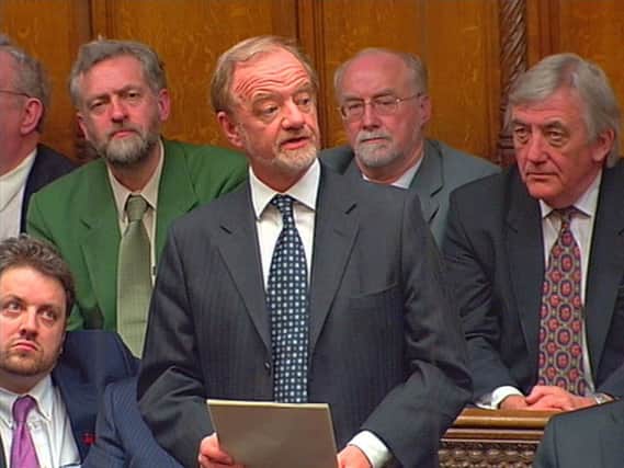 Jeremy Corbyn (back left) listens as Robin Cook (centre) makes his resignation speech in the House of Commons. Corbyn has condemned the decision to go to war in Iraq in 2003 as an "act of military aggression launched on a false pretext".