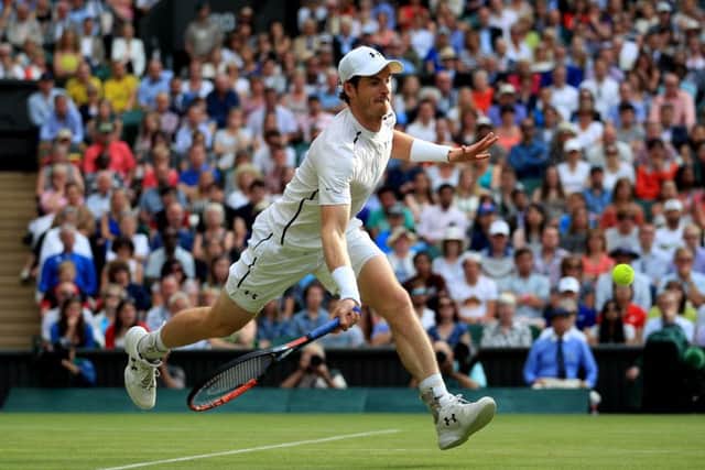 Andy Murray stretches to get a forehand return in against Jo-Wilfried Tsonga. Picture: John Walton/PA.