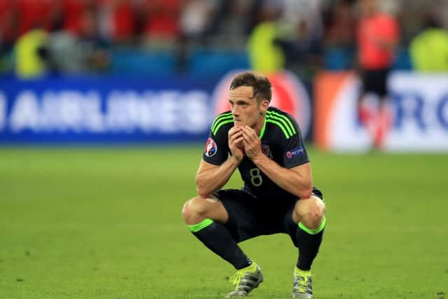 Wales' Andy King sits dejected following his side's 2-0 defeat to Portugal in Lyon. PRESS ASSOCIATION Photo. Picture: Mike Egerton/PA