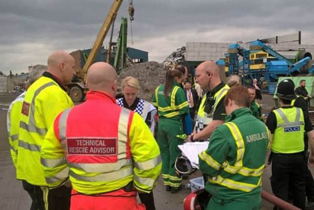 Emergency services at the scene where five men died after a wall collapsed at a recycling plant in the Nechells area of Birmingham (West Midlands Fire Service/PA)