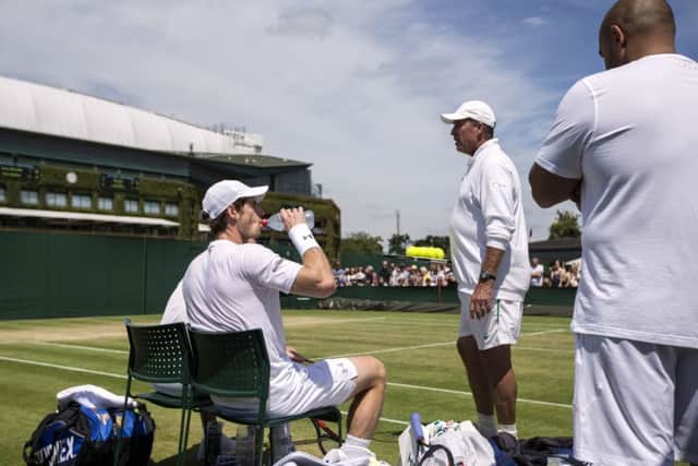 Andy Murray watched by coach Ivan Lendl. Picture: John Walton/PA
